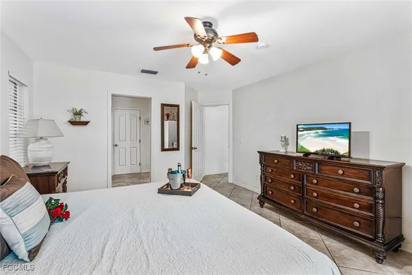 a bed room with a bed and a chandelier