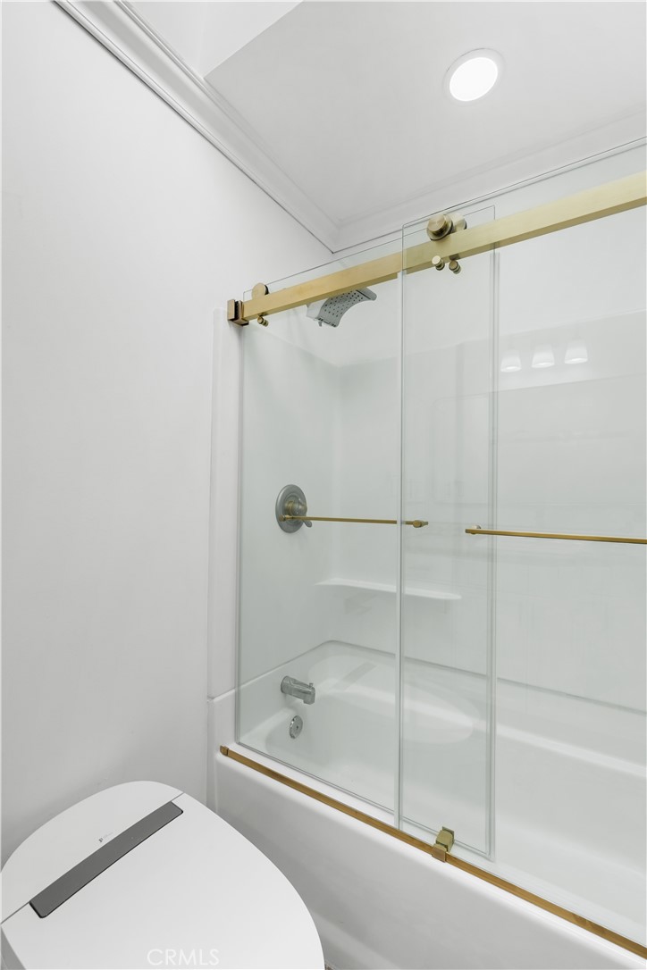 26096 Adamor Road Calabasas, CA 91302 - Photo 50 of 61 Family bathroom with tankless toilet, frameless shower doors and skylight.