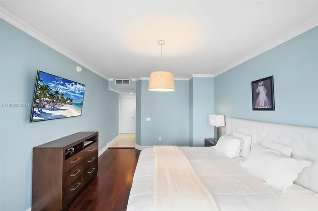 a bathroom with a bathtub a double vanity sink and mirror
