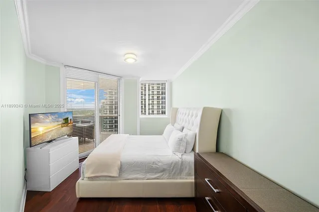 a bathroom with a shower sink vanity mirror and toilet