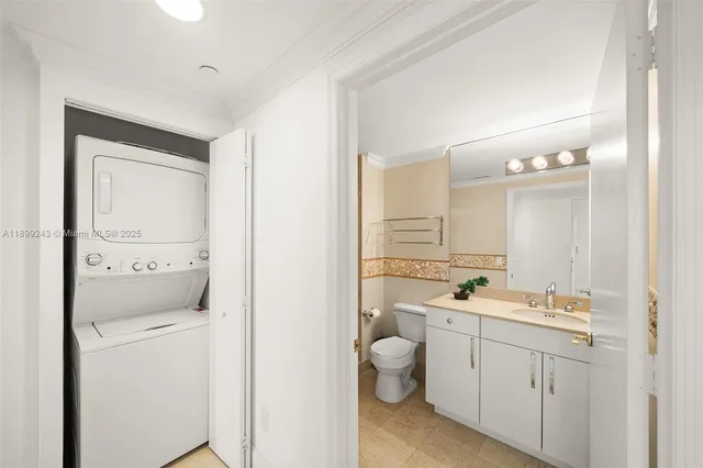 a bedroom with a white bed and a window