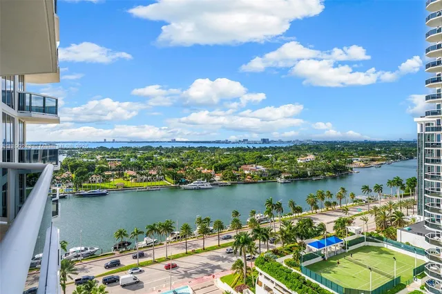 a view of a balcony with a table and chairs