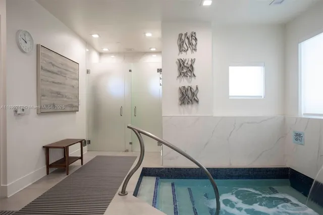 a view of swimming pool with outdoor seating