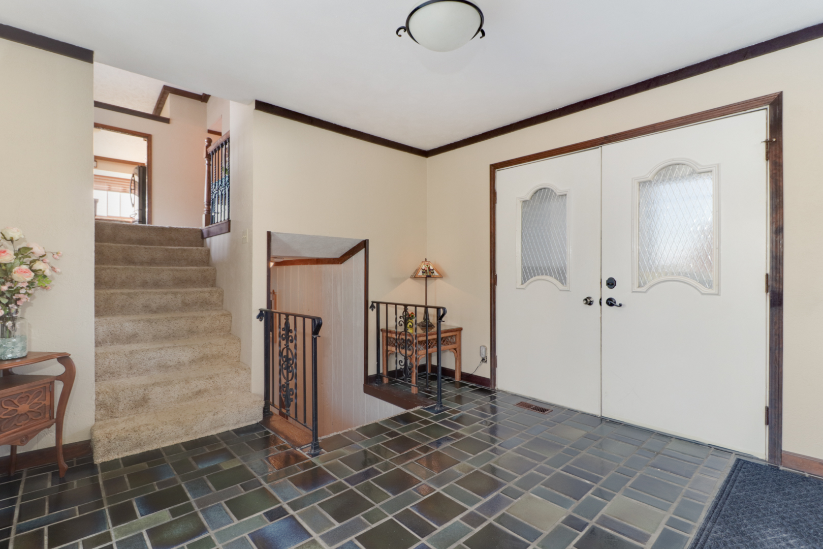 1607 Gregory Street Normal, IL 61761 - Photo 3 of 32 a view of a hallway with wooden floor and staircase