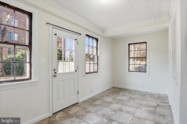 a view of an empty room with a window