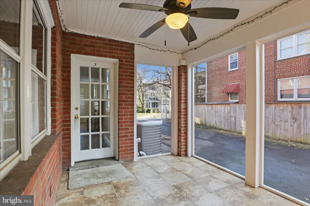 workspace with wooden floor and windows