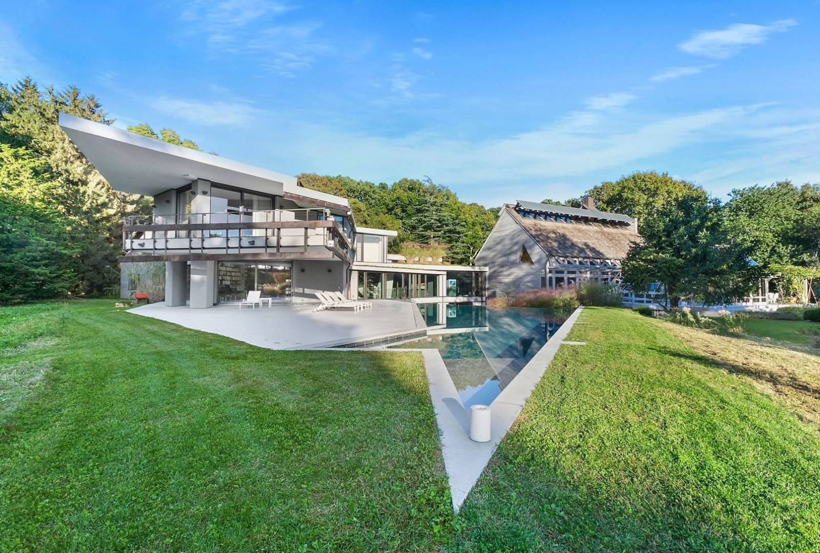 40 Sayre's Path Wainscott, NY 11975 - Photo 7 of 14 a view of a house with a big yard and a large tree