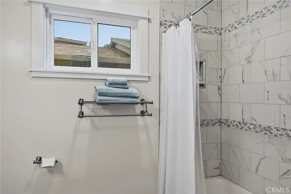 a bedroom with a bed and a table