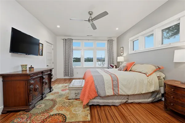 a bathroom with a granite countertop double vanity sink and a bathtub