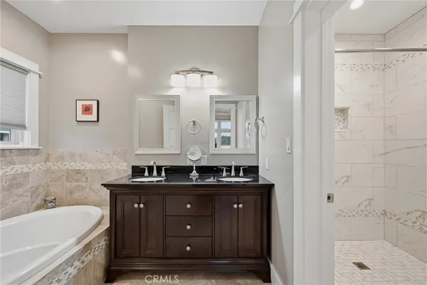 a bathroom with a bathtub and shower