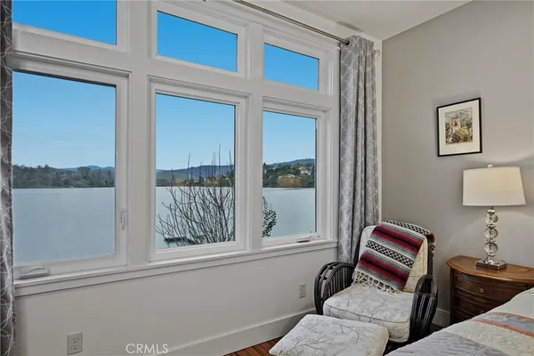 a living room with furniture and a chair