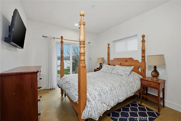 a view of a lake with a tree in the background