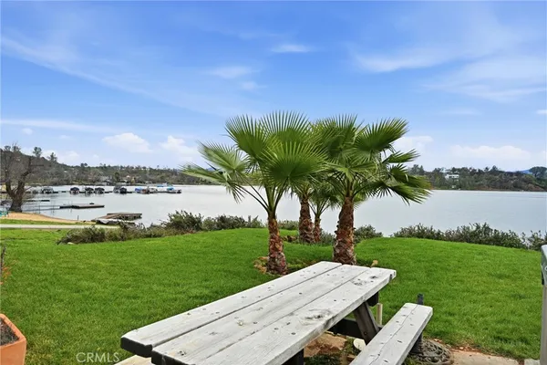 an aerial view of a house with yard swimming pool and outdoor seating