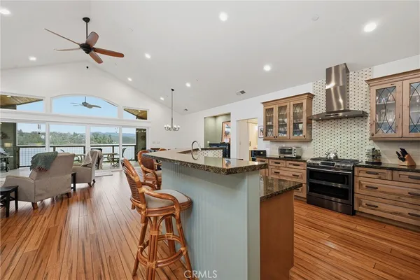 a kitchen with stainless steel appliances granite countertop a stove and a sink