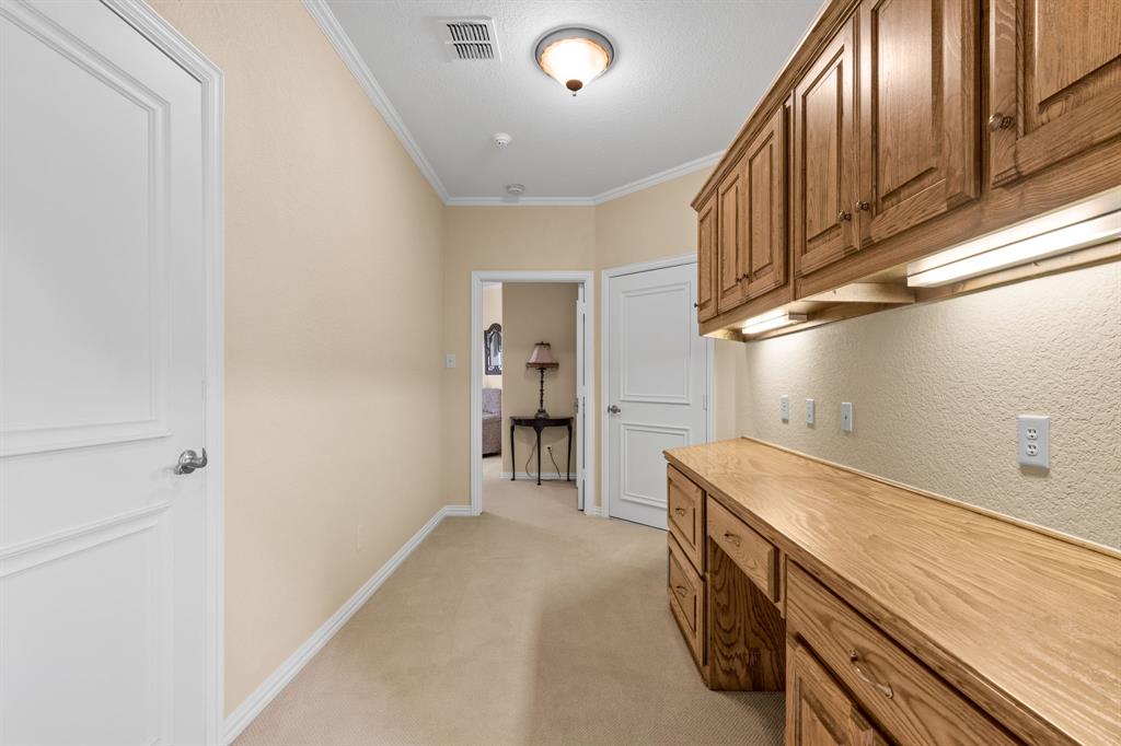 10072 Bluffview Circle Pilot Point, TX 76258 - Photo 26 of 38 Hallway featuring crown molding and light colored carpet