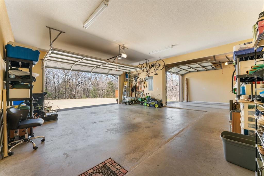 10072 Bluffview Circle Pilot Point, TX 76258 - Photo 30 of 38 Garage featuring electric panel