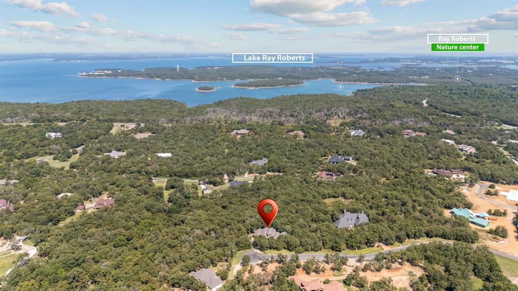 10072 Bluffview Circle Pilot Point, TX 76258 - Photo 34 of 38 Drone / aerial view of a heavily wooded area and a large body of water