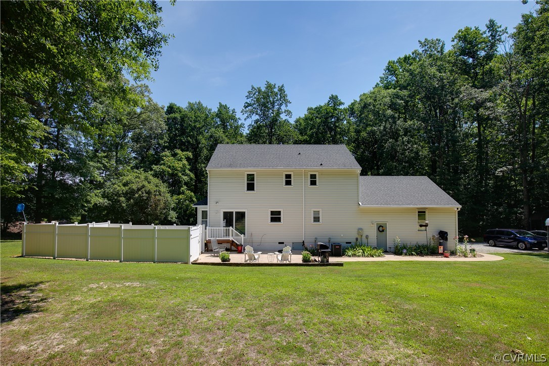 14810 Harrowgate Road Chester, VA 23831 - Photo 32 of 36 a backyard of a house with table and chairs