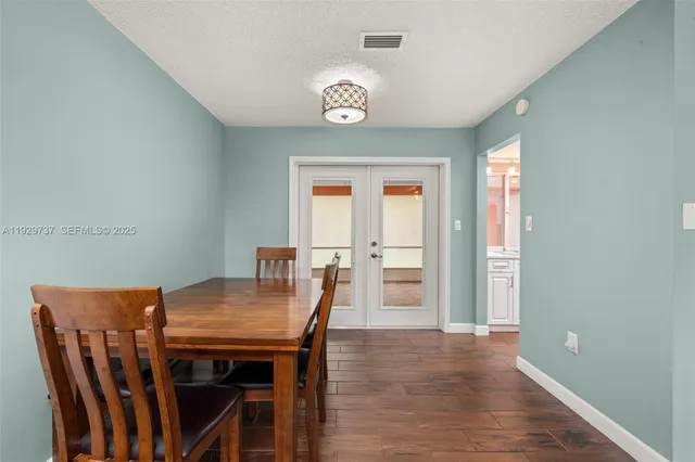 a kitchen with microwave stove and cabinets
