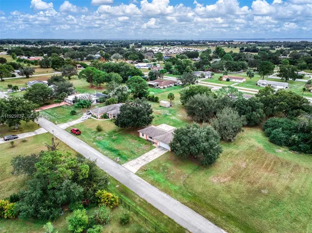 a view of a city with lots of residential buildings and mountain view