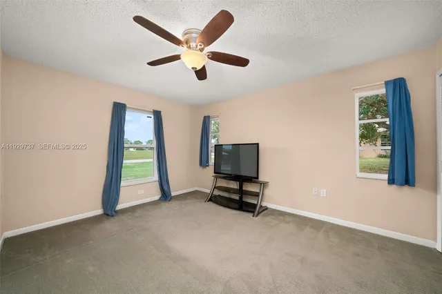 a view of a livingroom with a workspace