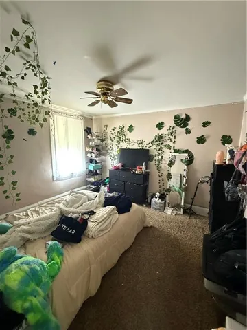 a bedroom with furniture and a window