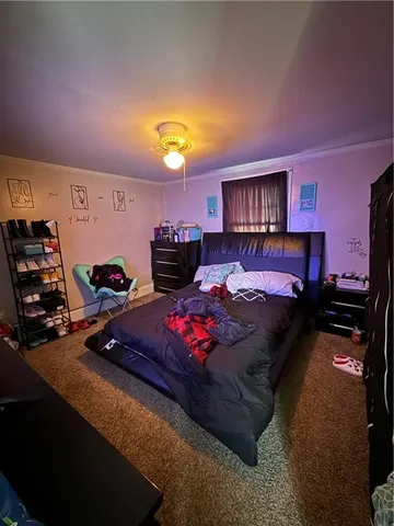 a bed room with a bed and a lamp
