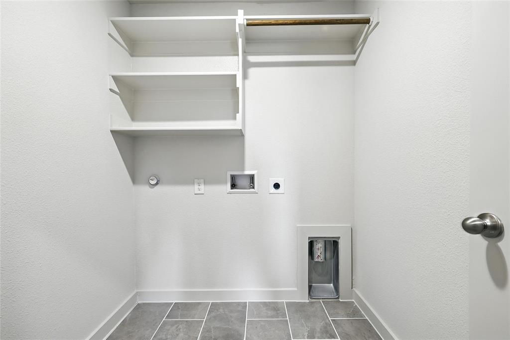1795 Gleasondale Place Forney, TX 75126 - Photo 25 of 29 Laundry room featuring hookup for a washing machine, electric dryer hookup, and a textured wall