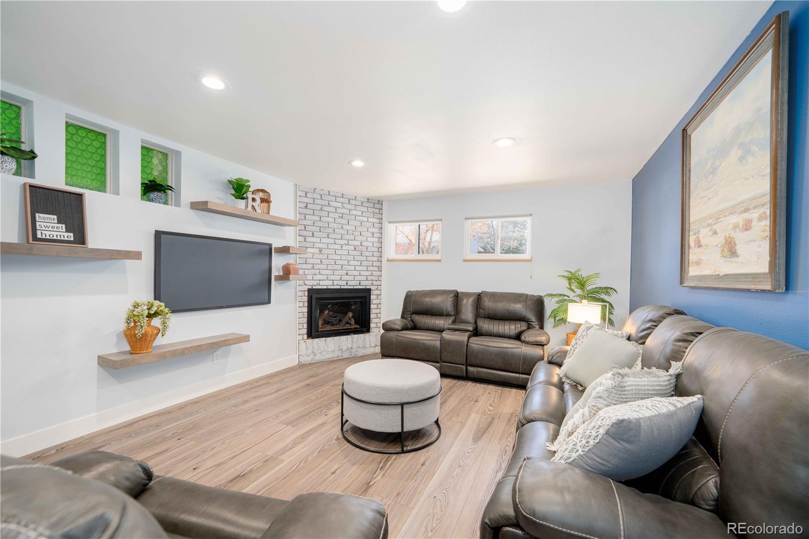 3815 East Easter Place Centennial, CO 80122 - Photo 15 of 35 a living room with furniture and a flat screen tv