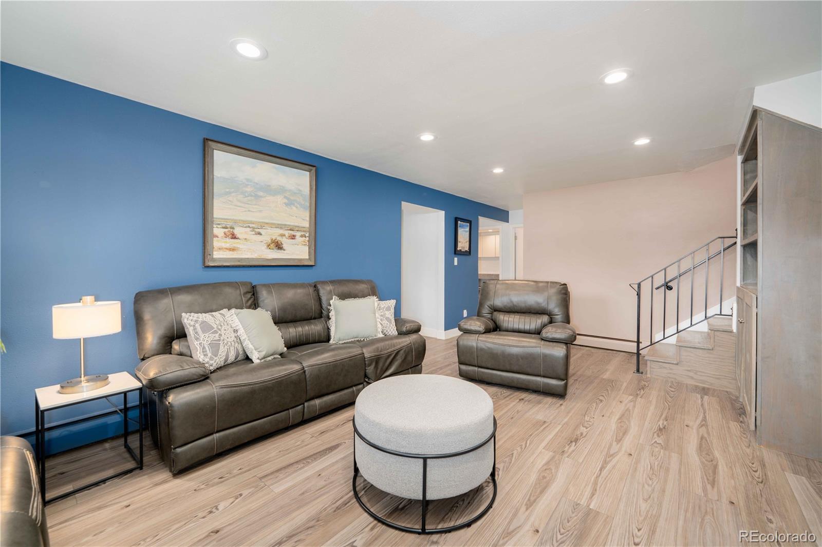 3815 East Easter Place Centennial, CO 80122 - Photo 16 of 35 a living room with furniture and a wooden floor