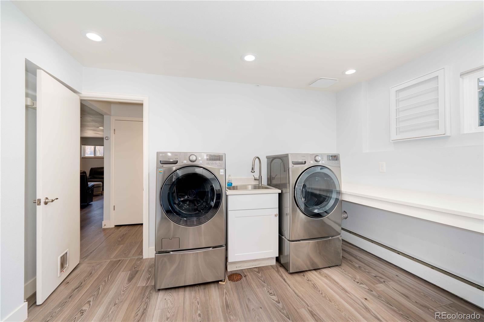 3815 East Easter Place Centennial, CO 80122 - Photo 20 of 35 a utility room with sink dryer and washer