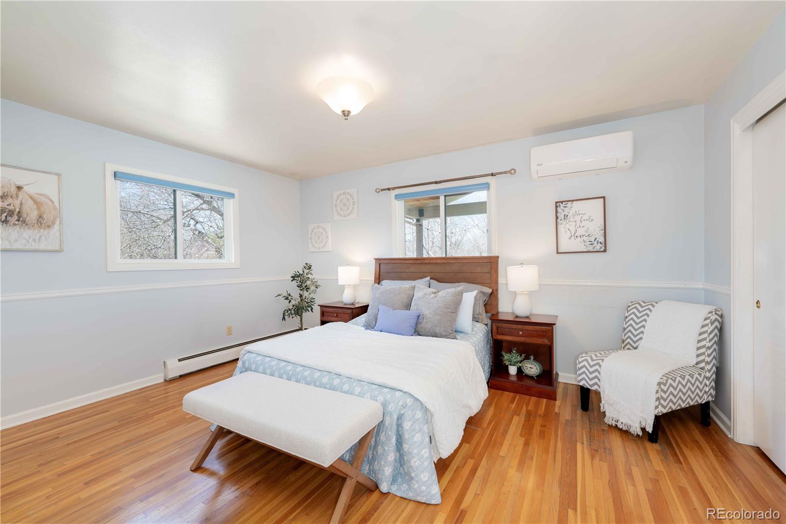 3815 East Easter Place Centennial, CO 80122 - Photo 9 of 35 a bedroom with a bed and wooden floor