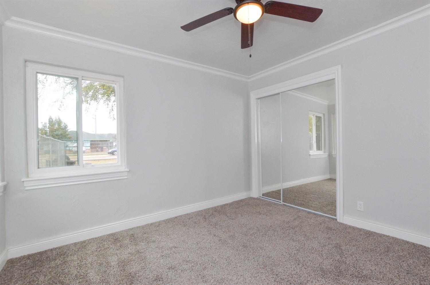 4613 West Andrews Fresno, CA 93722 - Photo 13 of 20 an empty room with a window