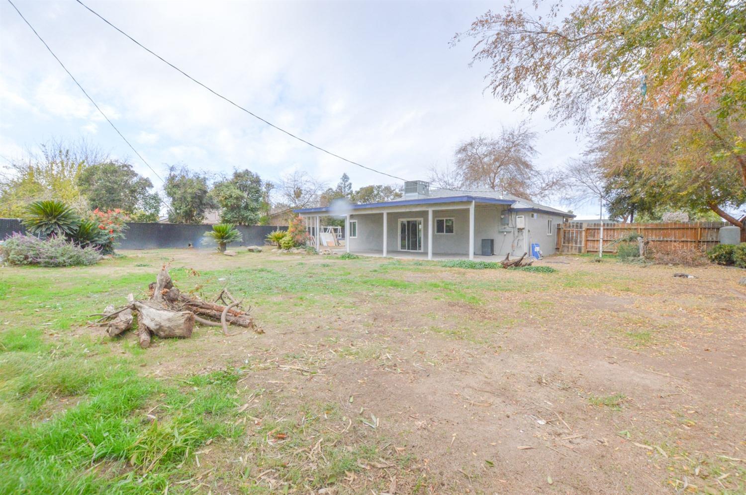 4613 West Andrews Fresno, CA 93722 - Photo 19 of 20 a view of a house with garden and sitting area