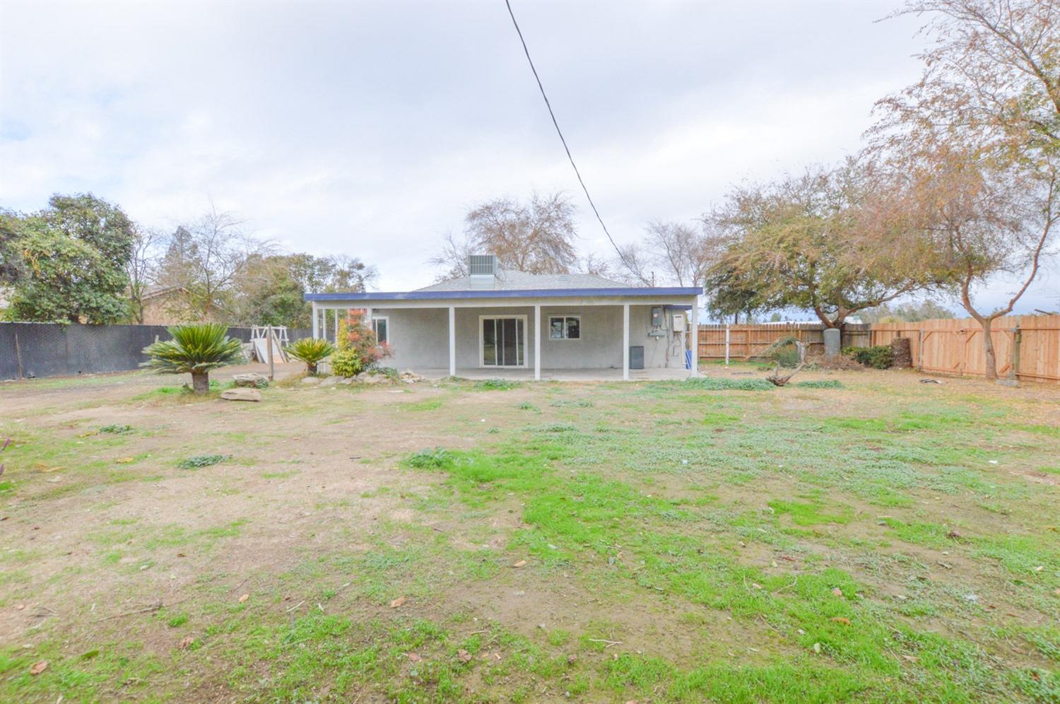 4613 West Andrews Fresno, CA 93722 - Photo 20 of 20 a front view of house with yard