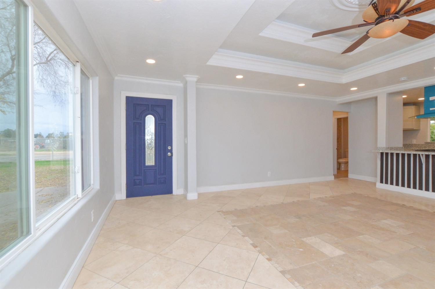4613 West Andrews Fresno, CA 93722 - Photo 3 of 20 a view of livingroom with an entryway