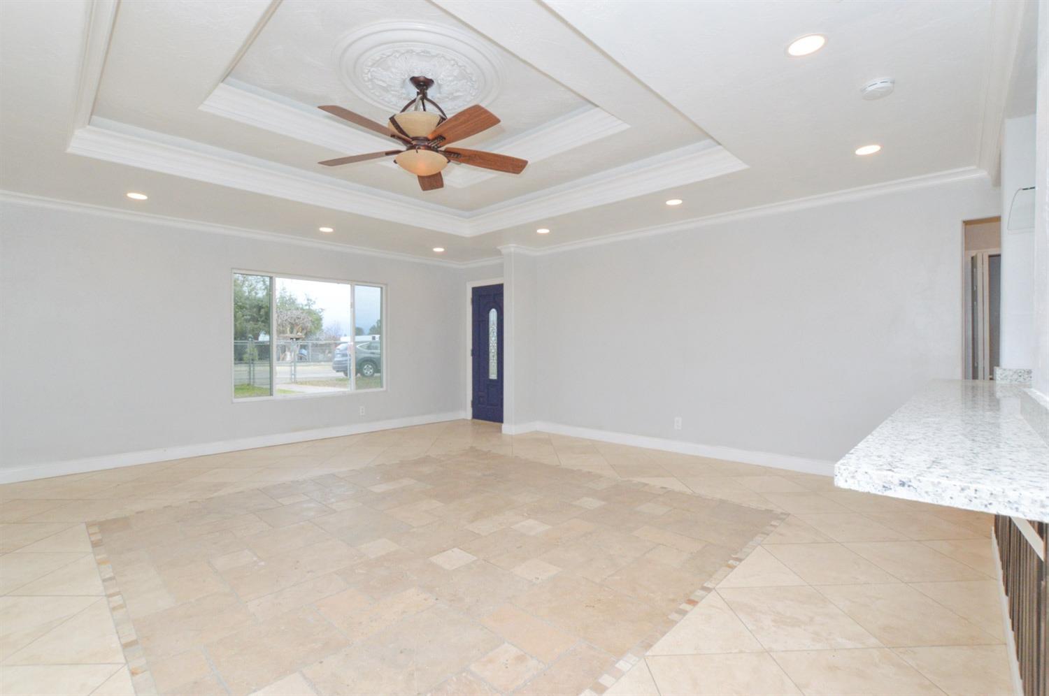 4613 West Andrews Fresno, CA 93722 - Photo 5 of 20 a view of an empty room with a window