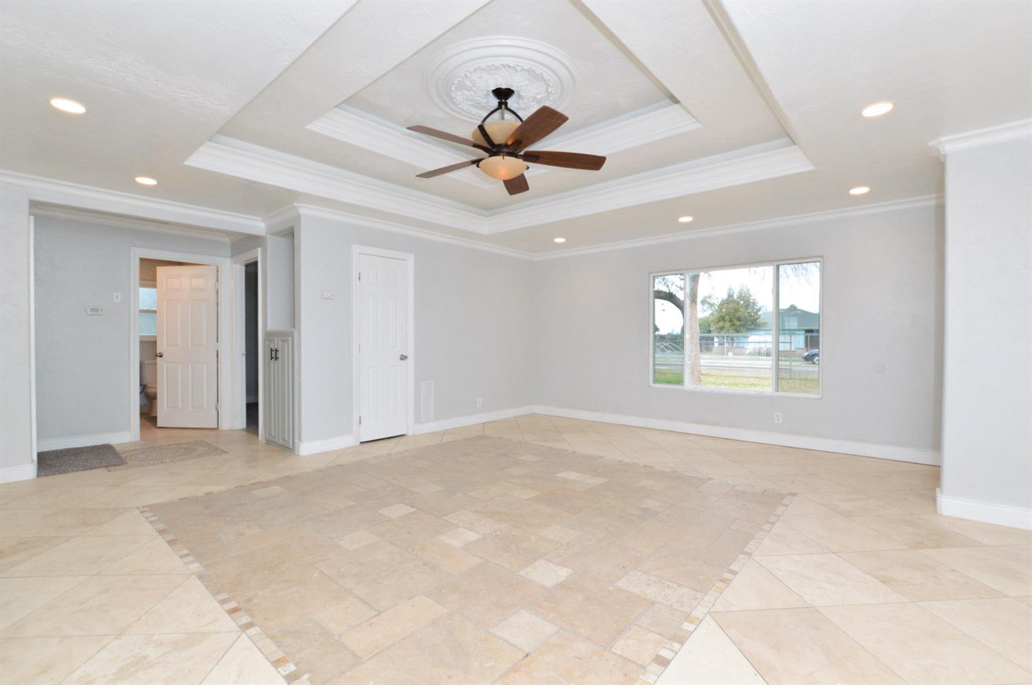 4613 West Andrews Fresno, CA 93722 - Photo 6 of 20 a view of an empty room with a window