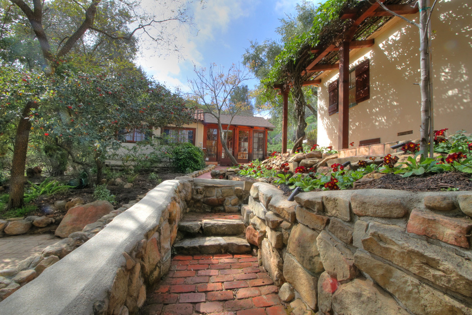 1331 Tunnel Road Santa Barbara, CA 93105 - Photo 5 of 22 a front view of a house with a yard