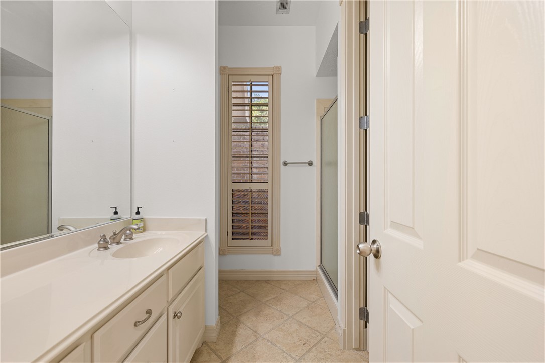 5011 Fairfield Court Bryan, TX 77802 - Photo 21 of 46 a bathroom with a sink and a mirror