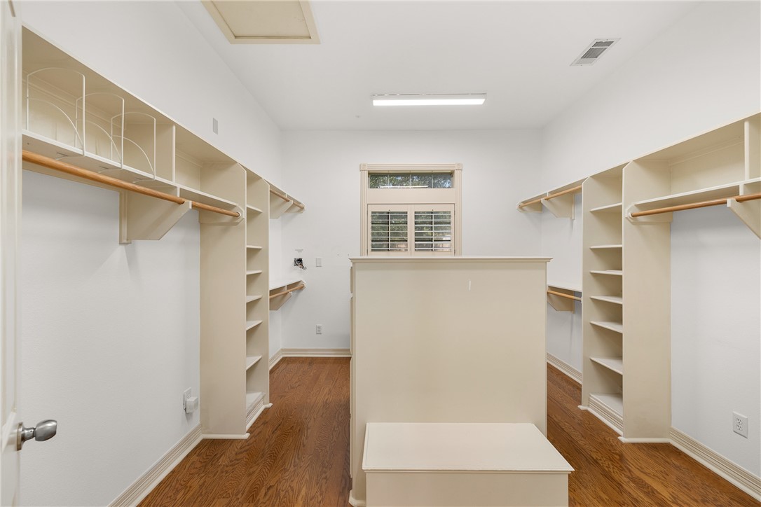 5011 Fairfield Court Bryan, TX 77802 - Photo 26 of 46 a view of walk in closet with empty racks