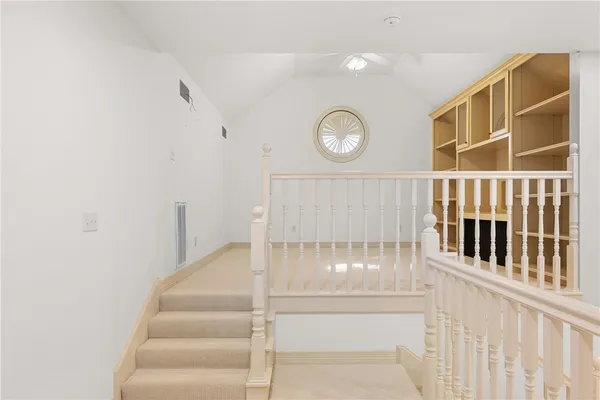 a view of an empty room with empty shelves