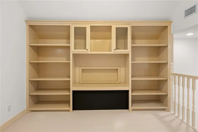 a view of staircase with white walls