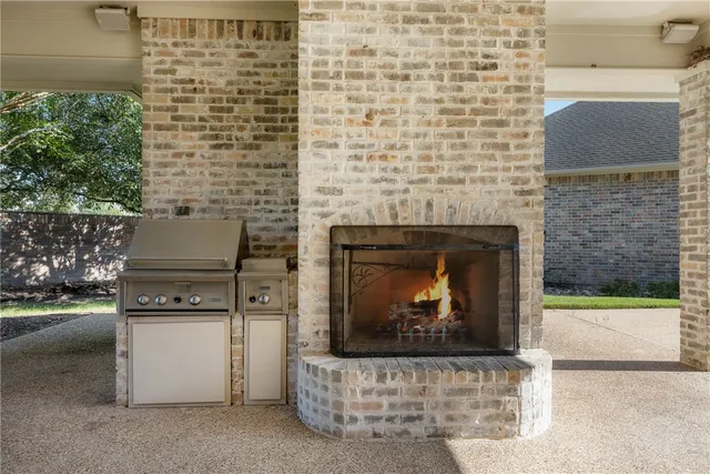 a view of a house with swimming pool and sitting area