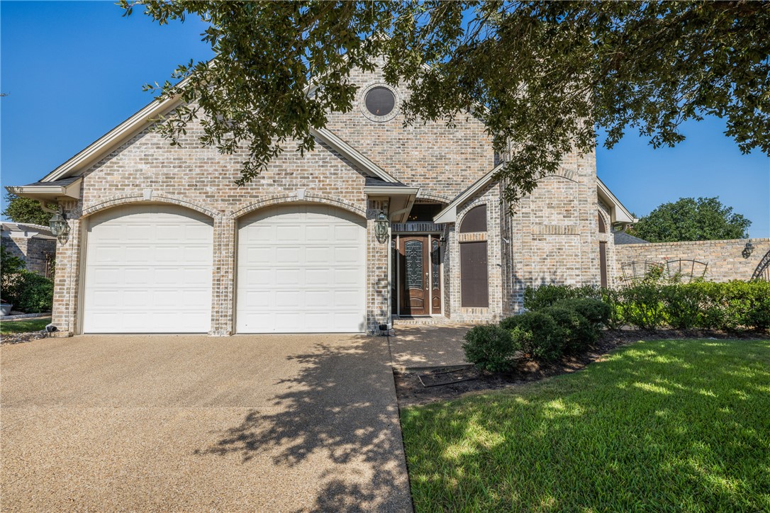 5011 Fairfield Court Bryan, TX 77802 - Photo 4 of 46 a front view of a house with garden