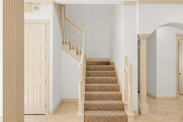 a view of staircase with white walls