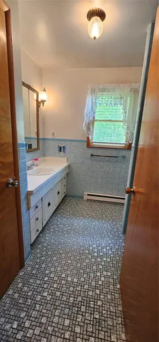 a bathroom with a sink a toilet and a bathtub