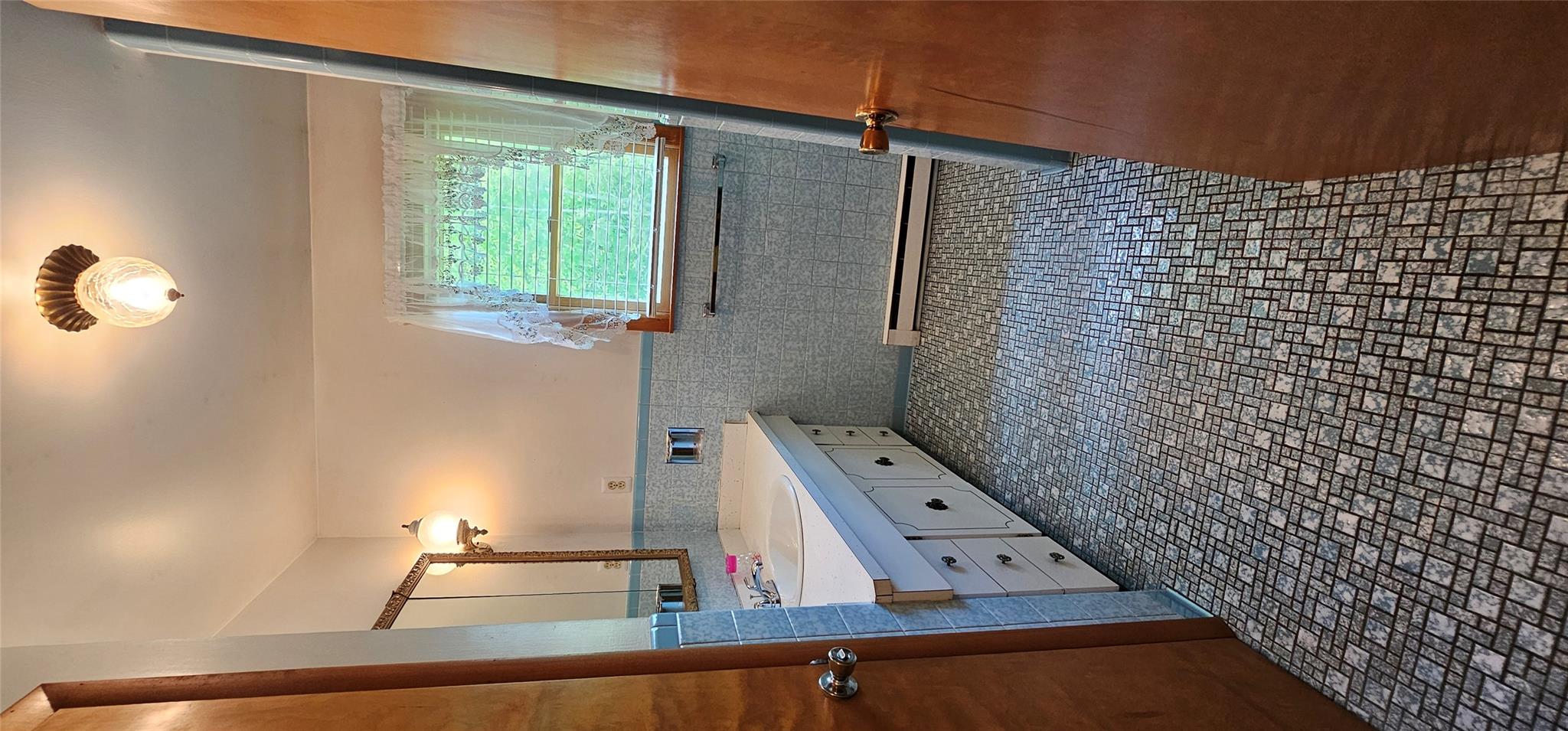 24 Buff Road Cochecton, NY 12726 - Photo 14 of 34 a bathroom with a sink a toilet and a bathtub