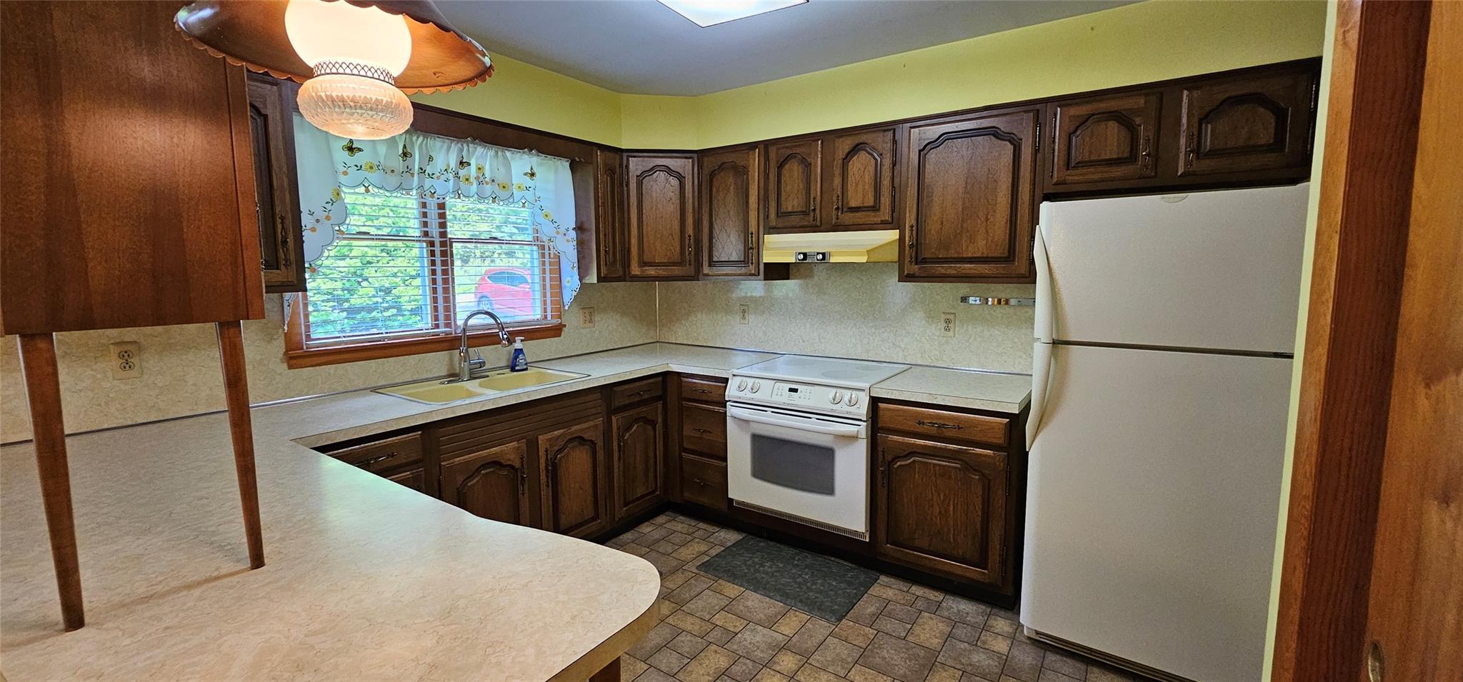 24 Buff Road Cochecton, NY 12726 - Photo 7 of 34 a kitchen with stainless steel appliances granite countertop a refrigerator a sink a stove a washer dryer and a refrigerator