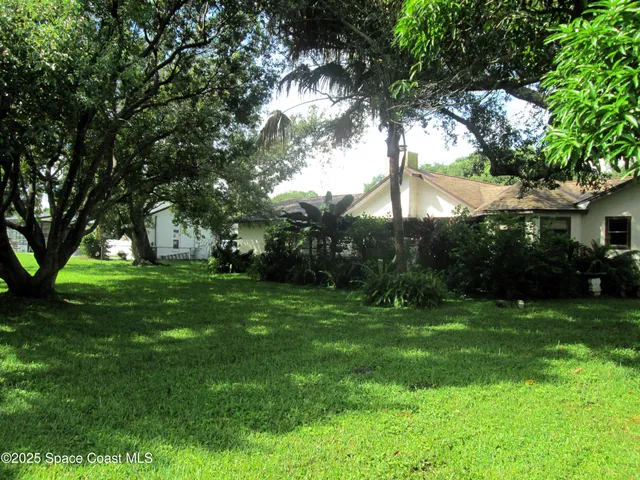 a backyard of a house with lots of green space
